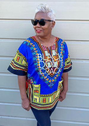 Our Black Don't Crack logo dashiki certainly makes a bold statement. It's 100% cotton with stay fast dye so the print won't fade or shrink. This multi-colored Afrocentric dashiki is lightweight and can be worn through the seasons.   100% Cotton          Machine Wash            Hang Dry   