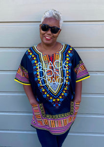 Our Black Don't Crack logo dashiki certainly makes a bold statement. It's 100% cotton with stay fast dye so the print won't fade or shrink. This multi-colored Afrocentric dashiki is lightweight and can be worn through the seasons.   100% Cotton          Machine Wash            Hang Dry   