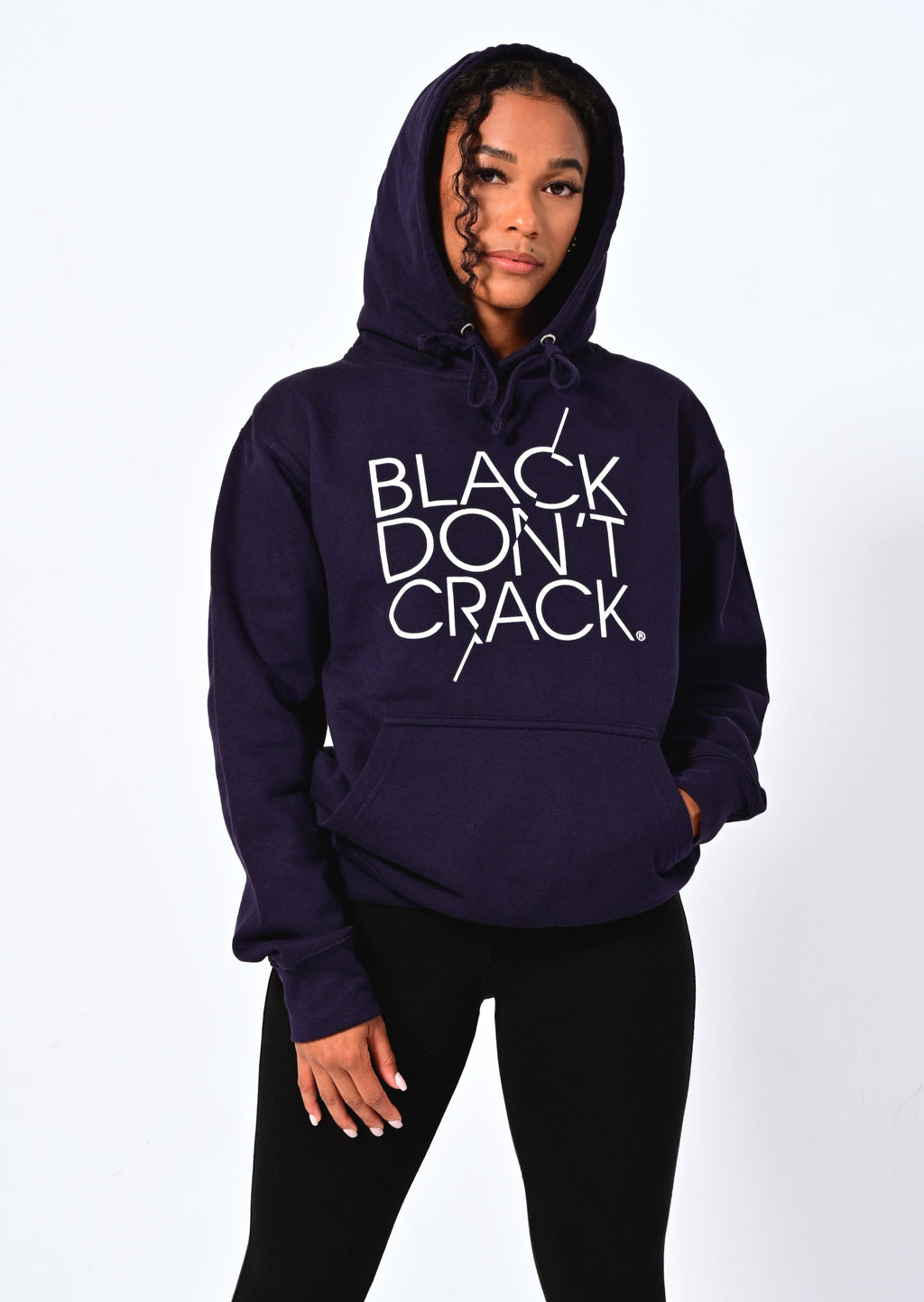 Our 9 oz logo Navy Black Don’t Crack hoodie is a classic fit sweatshirt. It has a roomy front kanga pocket, an adjustable drawstring hood to keep you warm and cozy. This signature overhead hoodie is made with soft but durable dual blend fabric. If you want comfort and style make this your favorite all day hoodie.  80% Cotton 20% Poly Wash In Cold Water Or Dry Clean Hang Dry For Best Results